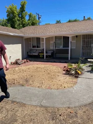 Front yard raked clean after a Firefighter Tree Service tree removal in a Redwood City neighborhood